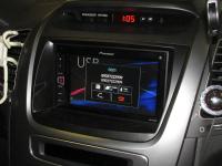 Фотография установки магнитолы Pioneer MVH-AV280BT в KIA Sorento II (XM FL)