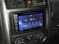 Фотография установки магнитолы Alpine INE-W990HDMI в Suzuki Jimny