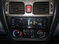 Фотография установки магнитолы Pioneer MVH-8300BT в Nissan Almera