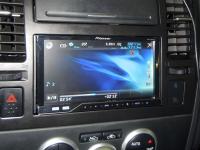 Фотография установки магнитолы Pioneer AVH-P4300DVD в Nissan Tiida