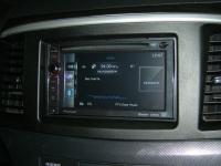 Фотография установки магнитолы Pioneer AVIC-F930BT в Mitsubishi Lancer X