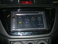 Фотография установки магнитолы Pioneer AVIC-F930BT в Mitsubishi Lancer