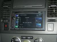 Фотография установки магнитолы Pioneer AVIC-F930BT в Nissan Tiida